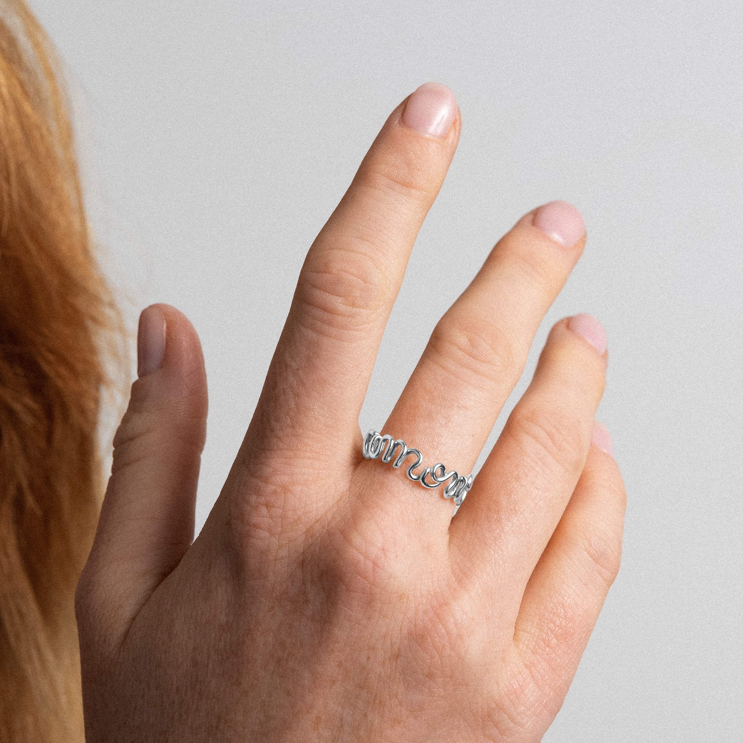 Original ring with word Amour sterling silver worn on hand Atelier Paulin Australia