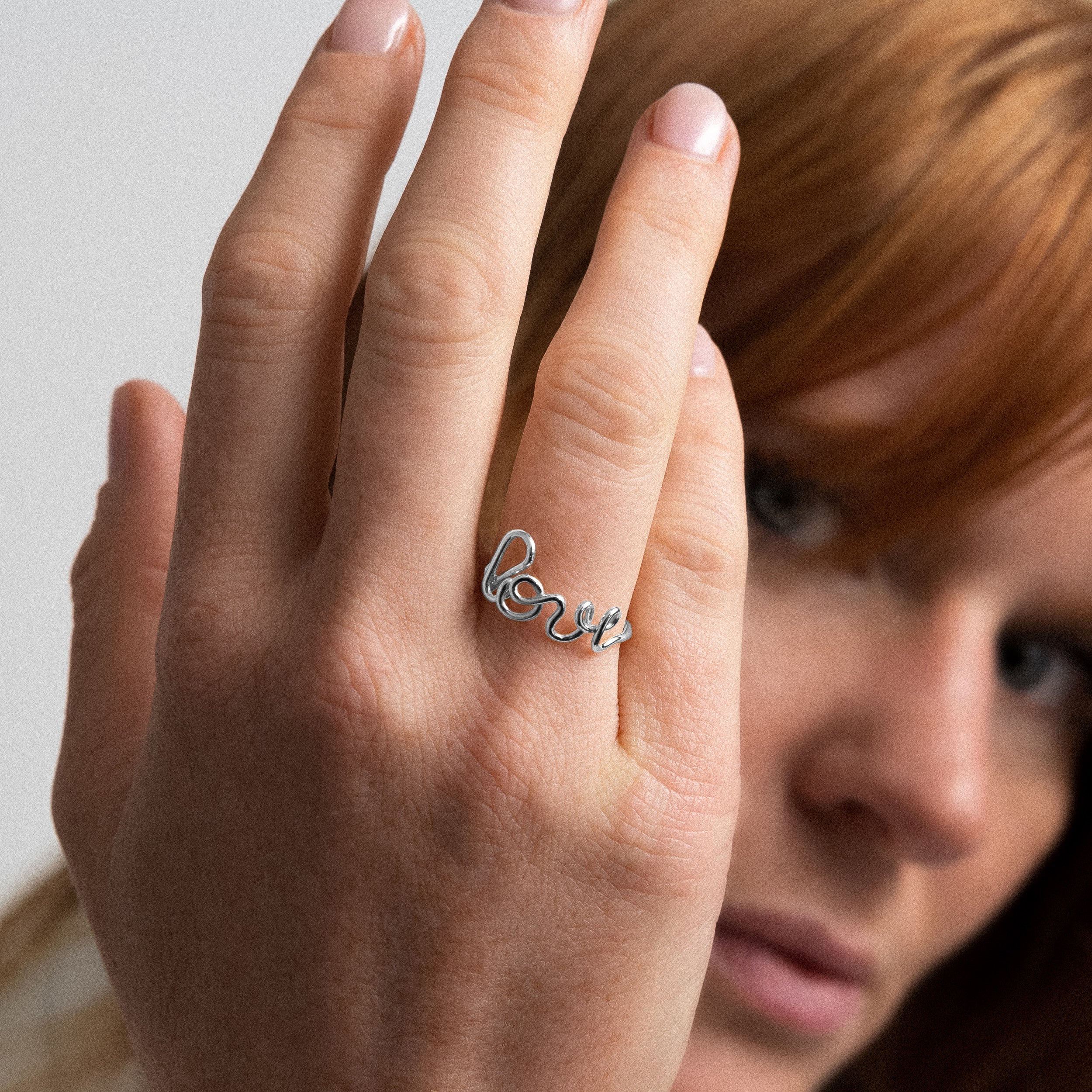 Original ring word Love silver gold worn on finger handmade in France Atelier Paulin Australia