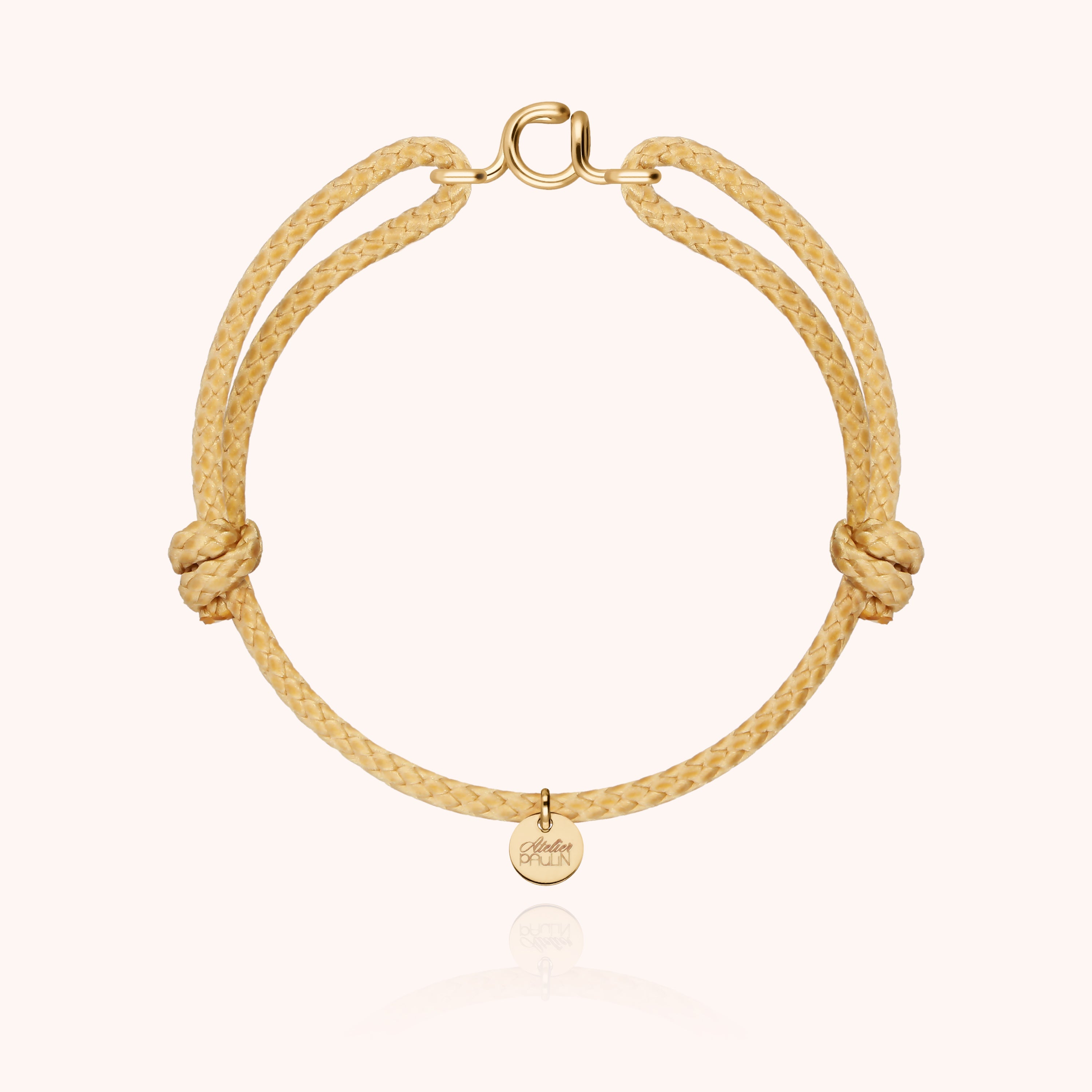 Waxed cord bracelet for men. Personalised gold jewellery with letter initial handcrafted in Paris by Atelier Paulin in 14K yellow gold-filled --colour_nude