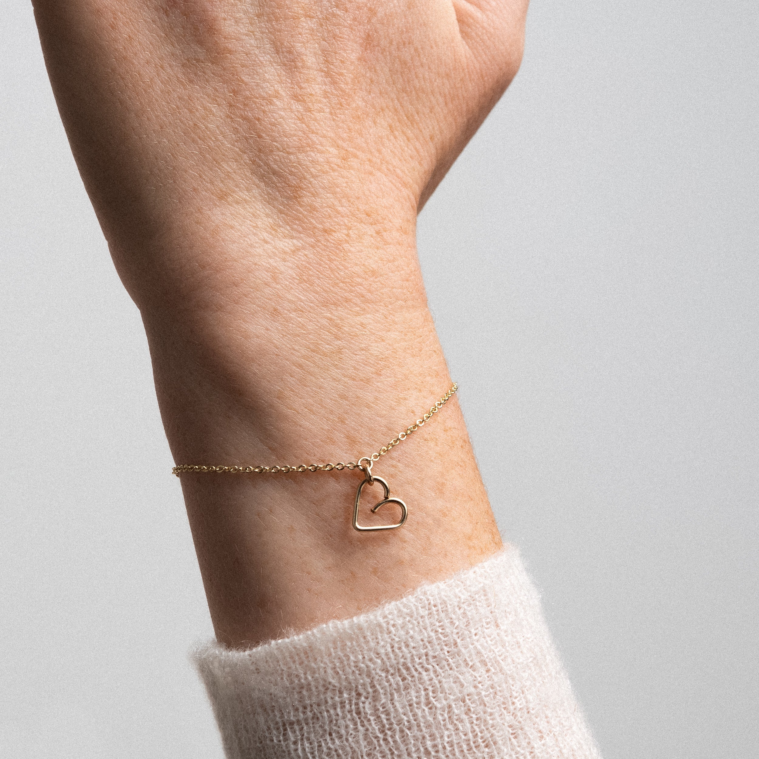 Lucky One Heart charm bracelet yellow gold worn on wrist women jewellery Atelier Paulin Australia