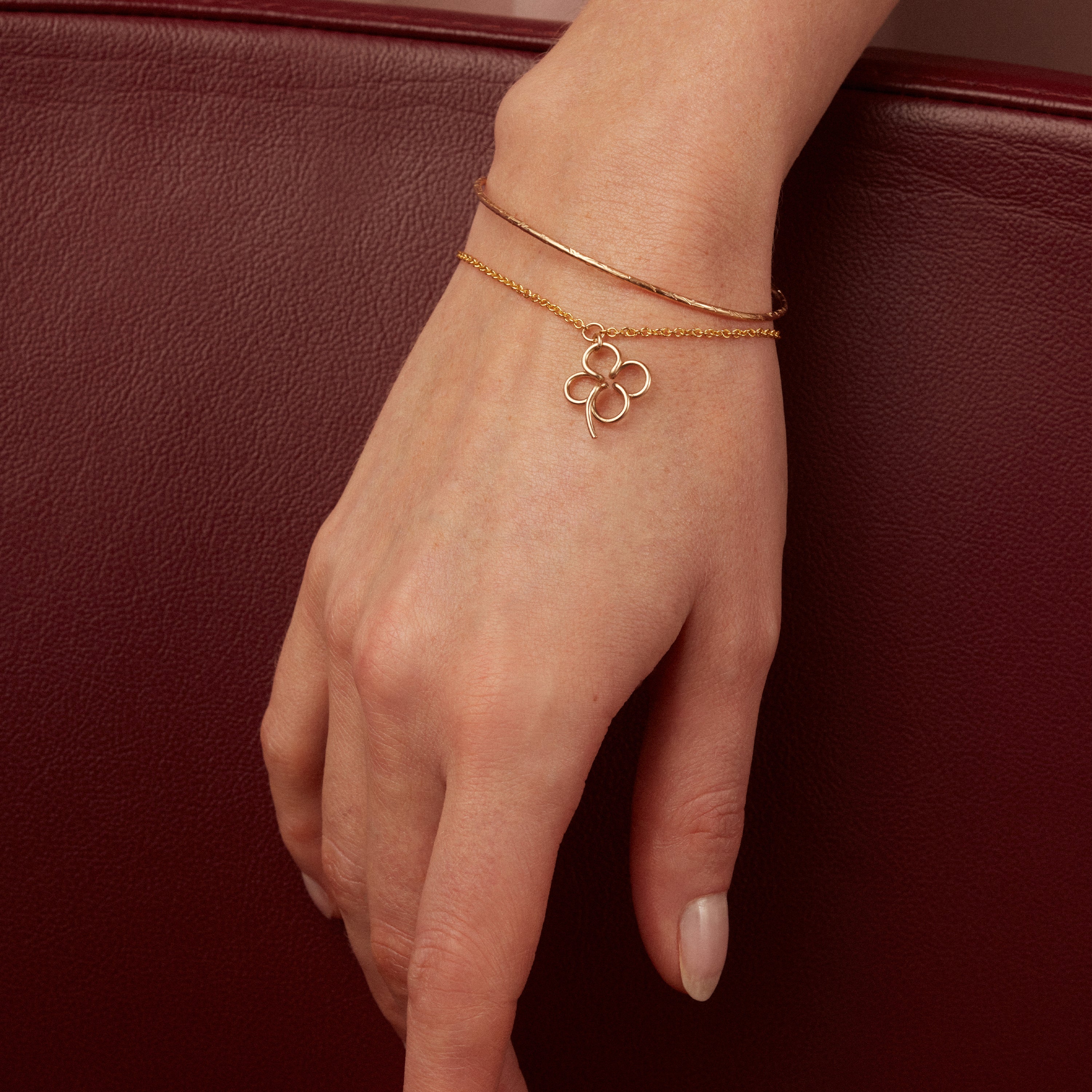 Lucky One Clover Charm Bracelet 14k yellow gold-filled worn on wrist handcrafted