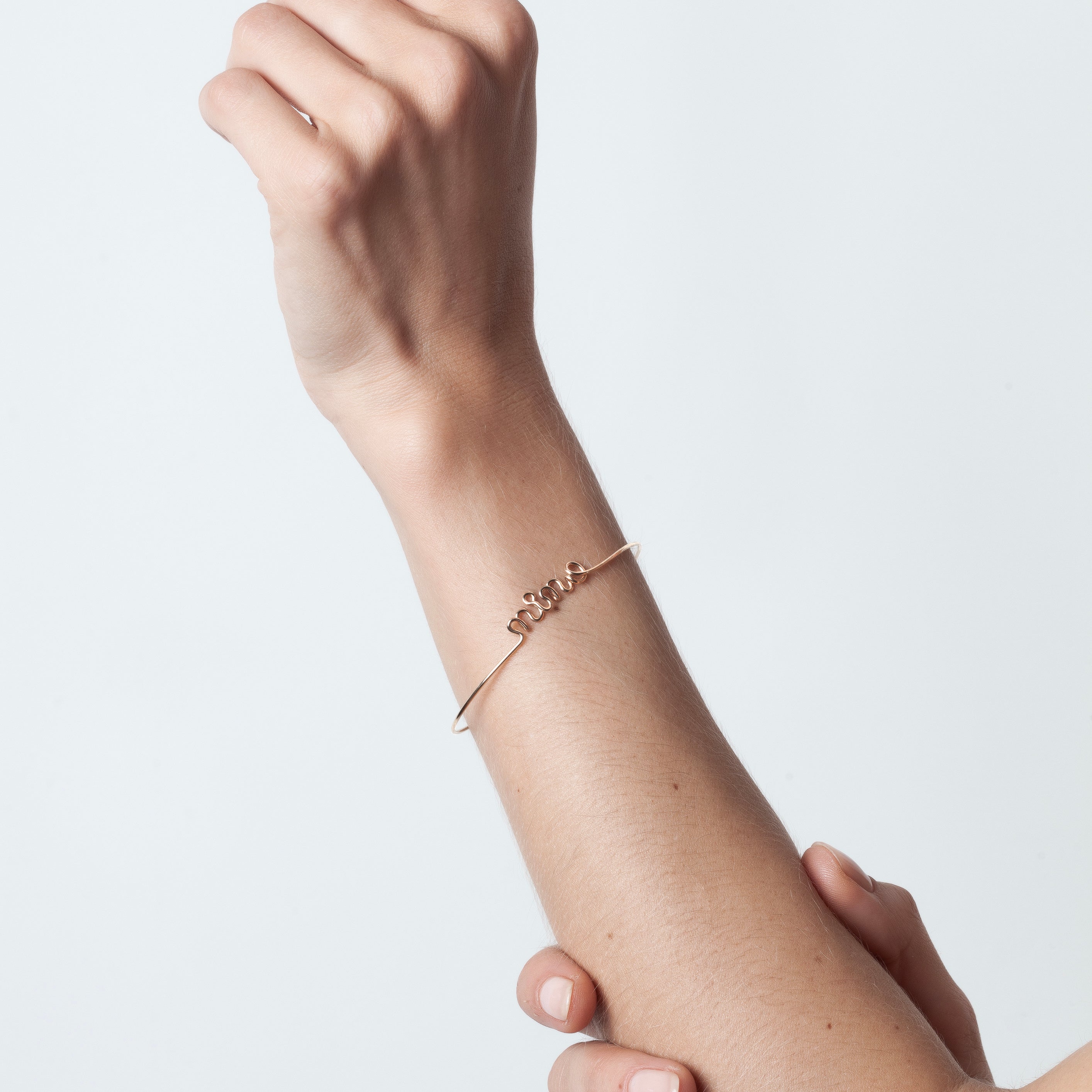 Original wire bracelet with name personalisation yellow gold worn on wrist handcrafted Atelier Paulin Australia
