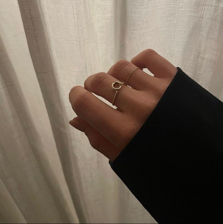 hand wearing personalised ring letter initial letter a in yellow gold