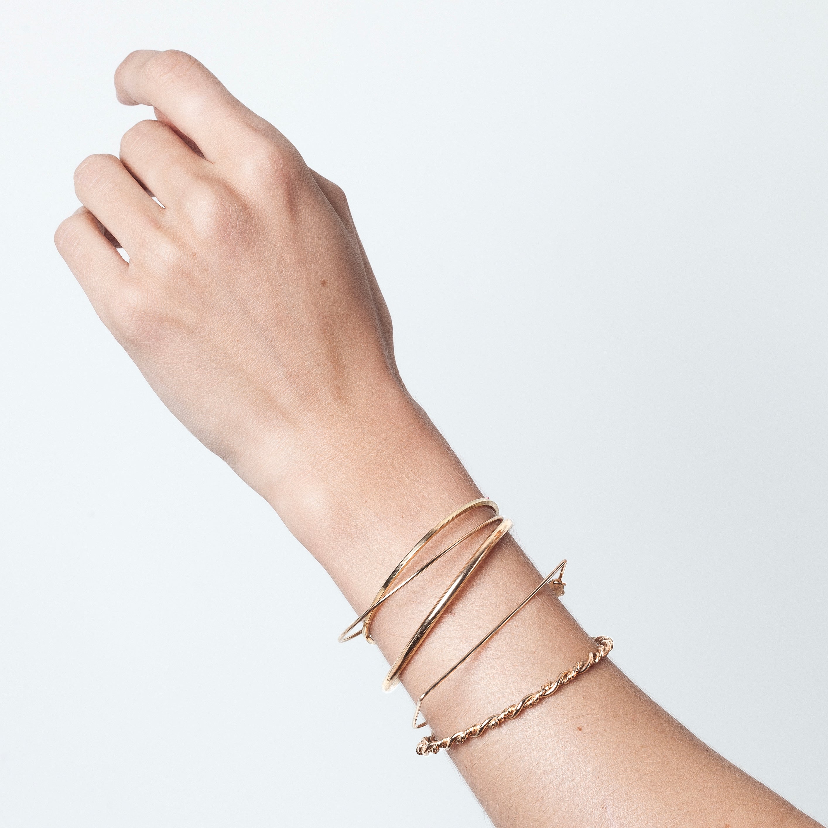 Bracelet O Cube yellow gold stacking on wrist Atelier Paulin Australia