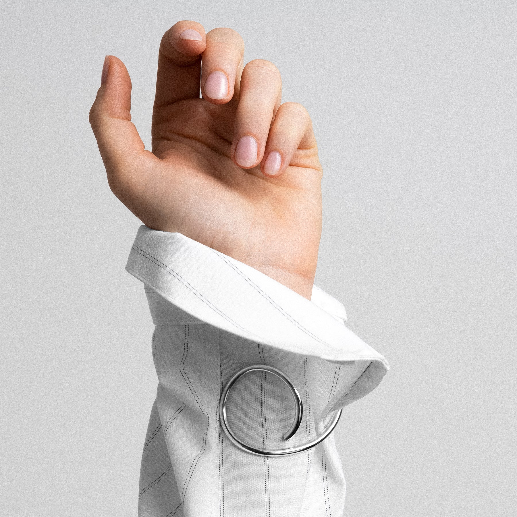 Outline cuff letter e silver worn over shirt styling accessory Atelier Paulin Australia