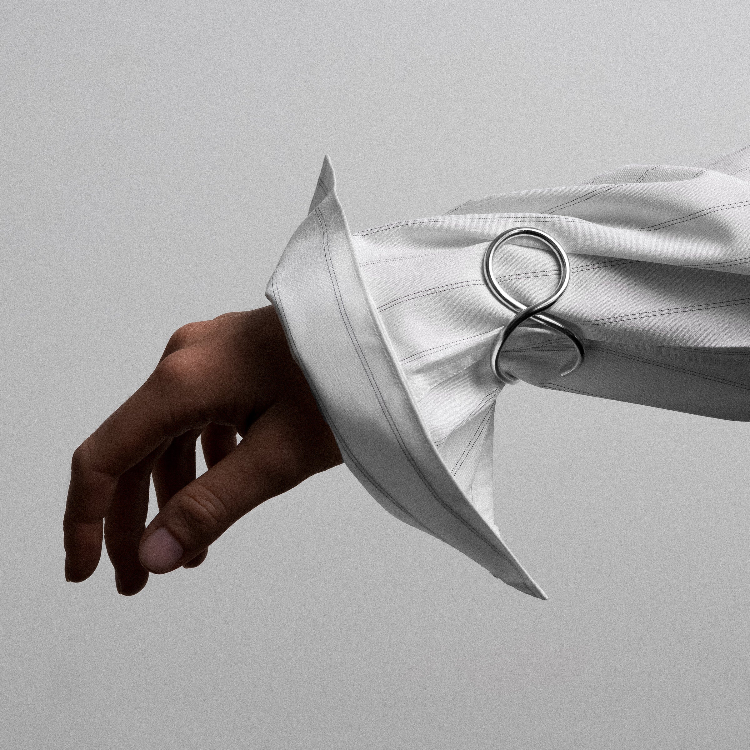 Outline cuff bracelet letter v silver worn over shirt handmade Atelier Paulin Australia