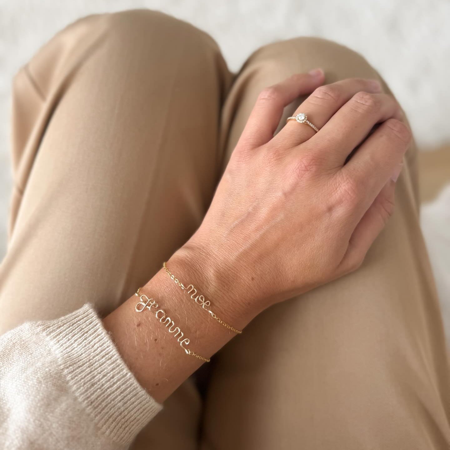 Gold chain bracelets, one featuring the name 'Noe' and the other 'Je t'aime'. Personalised handmade jewellery Atelier Paulin