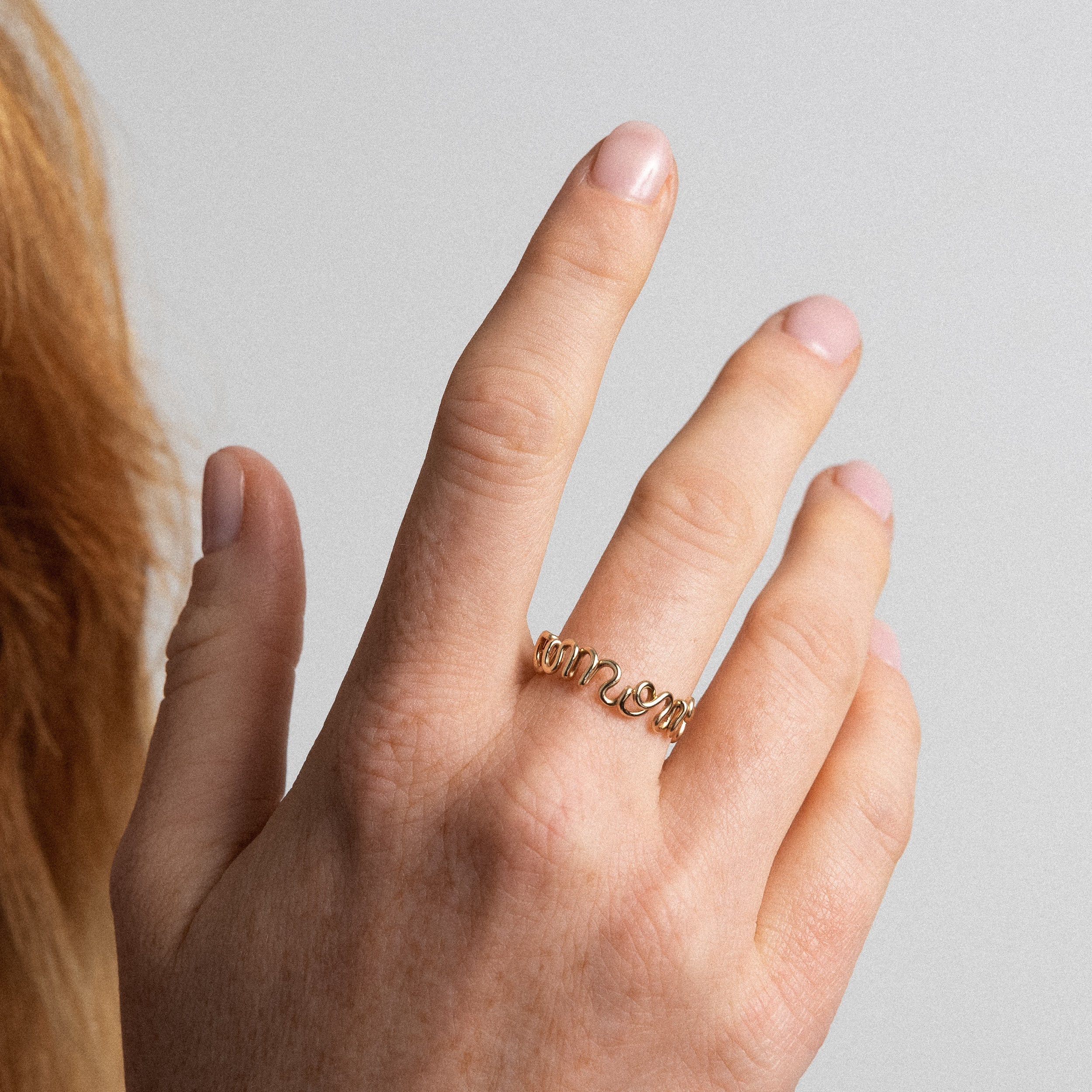 Original ring with word Amour 14K yellow gold-filled worn on hand Atelier Paulin Australia