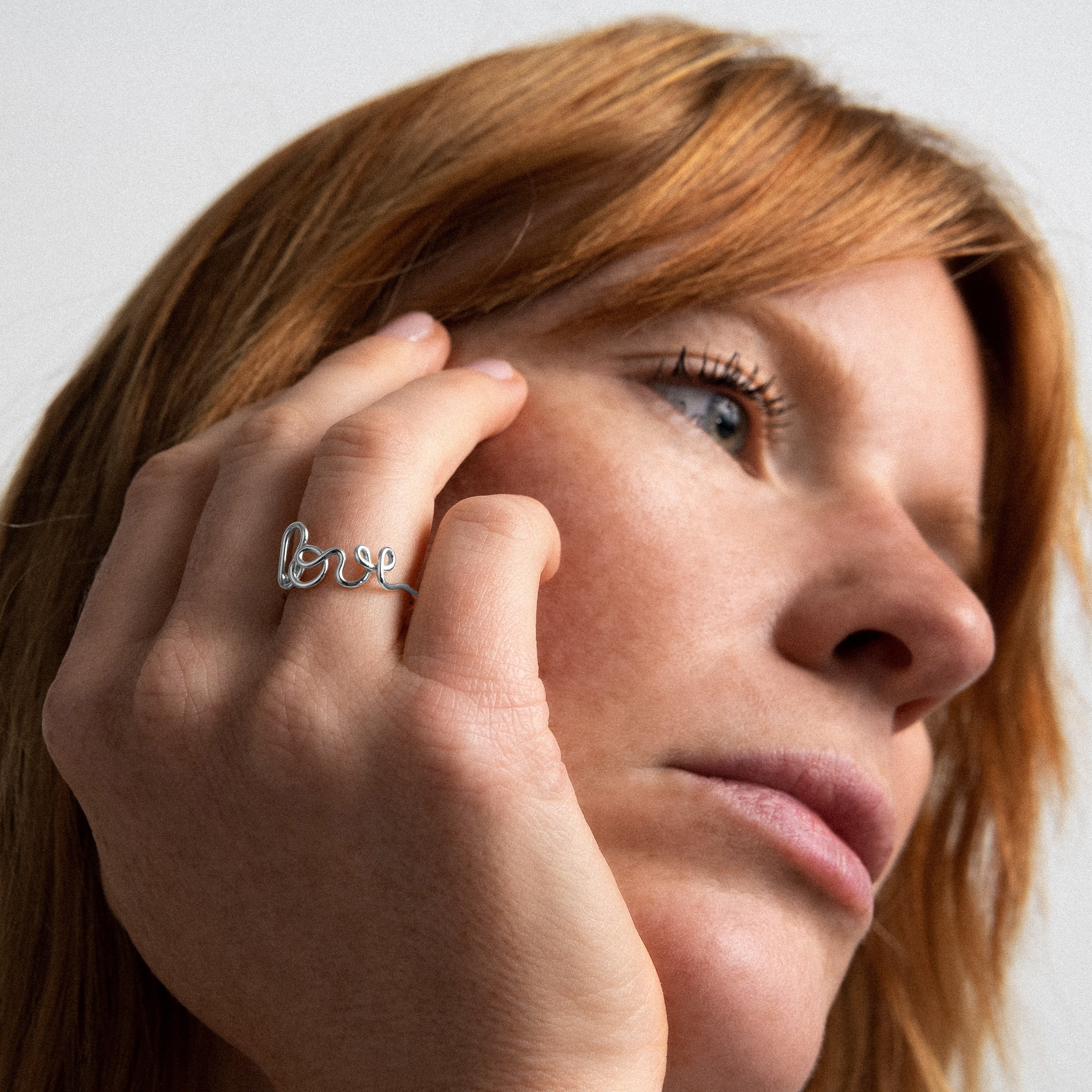 Original ring word Love silver worn on finger Atelier Paulin Australia