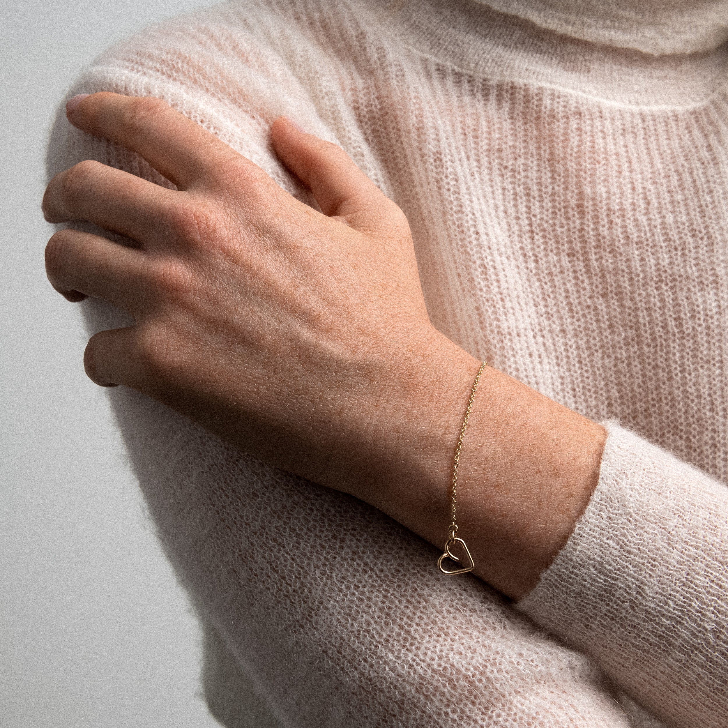 Lucky One Heart charm bracelet yellow gold worn on wrist handcrafted Atelier Paulin Australia