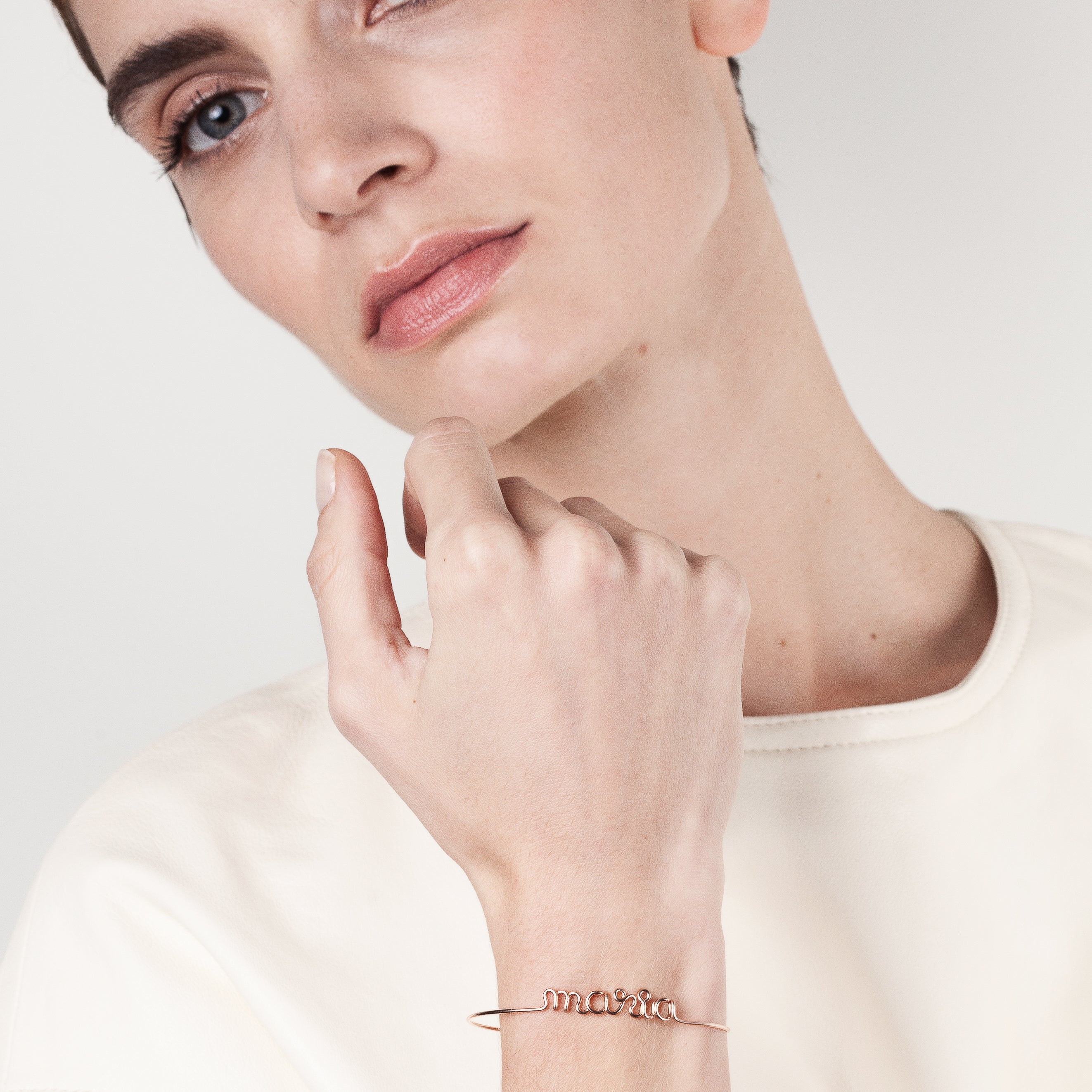 Original wire bracelet with name personalisation yellow gold worn on wrist handcrafted Atelier Paulin Australia