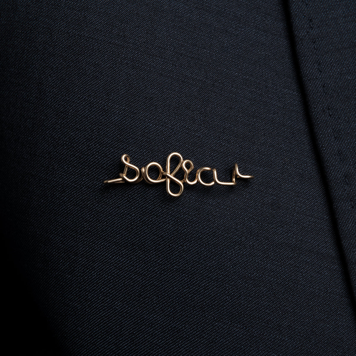 gold brooch on black blazer with name personalisation Atelier Paulin